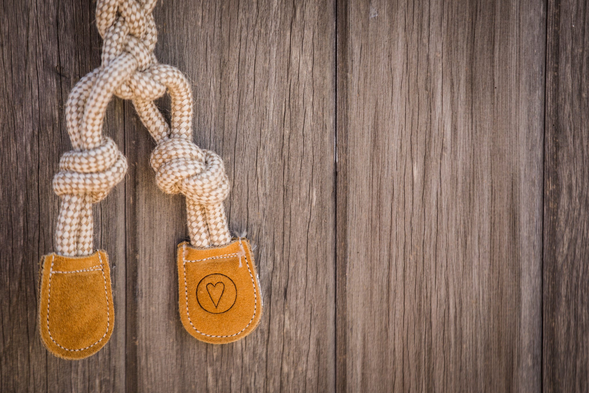 Close up image of the HuggleGroup heart that is placed on the right foot of every Natural Rope Knottie®.