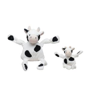 Large and Small Dottie the Cow dog toy. The cow is white with black spots all over with a white and black tail. Has five squeakers one in each arm, leg and in the stomach. Made with exclusive Tuffut Technology®.