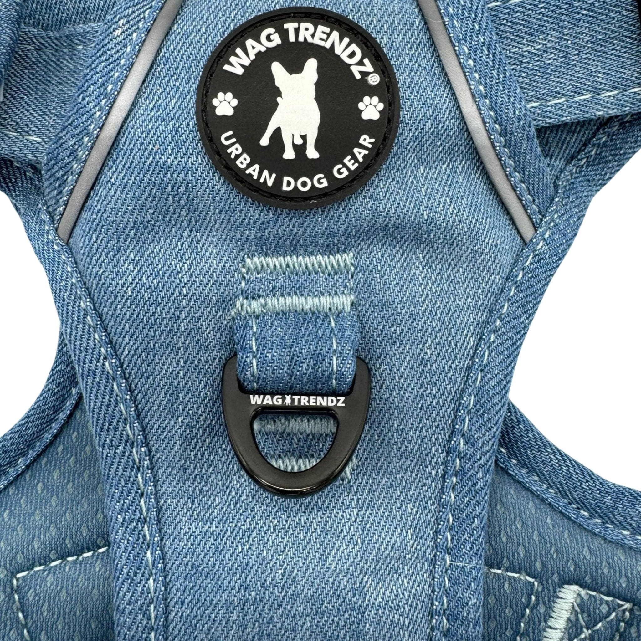 Dog Harness With Handle - No Pull - Downtown Denim Dog Harness - close up of chest side of harness showing rubber logo and the no pull leash attachment - against solid white background - Wag Trendz