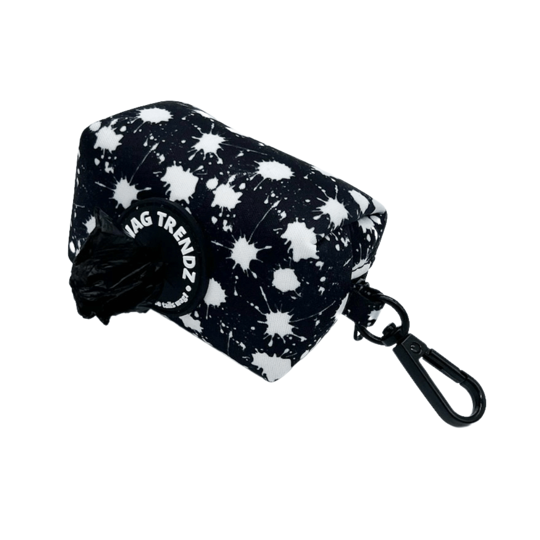 Dog Poo Bag Holder - black with white paint splatter and Wag Trendz rubber logo with poop bag against white background - Wag Trendz
