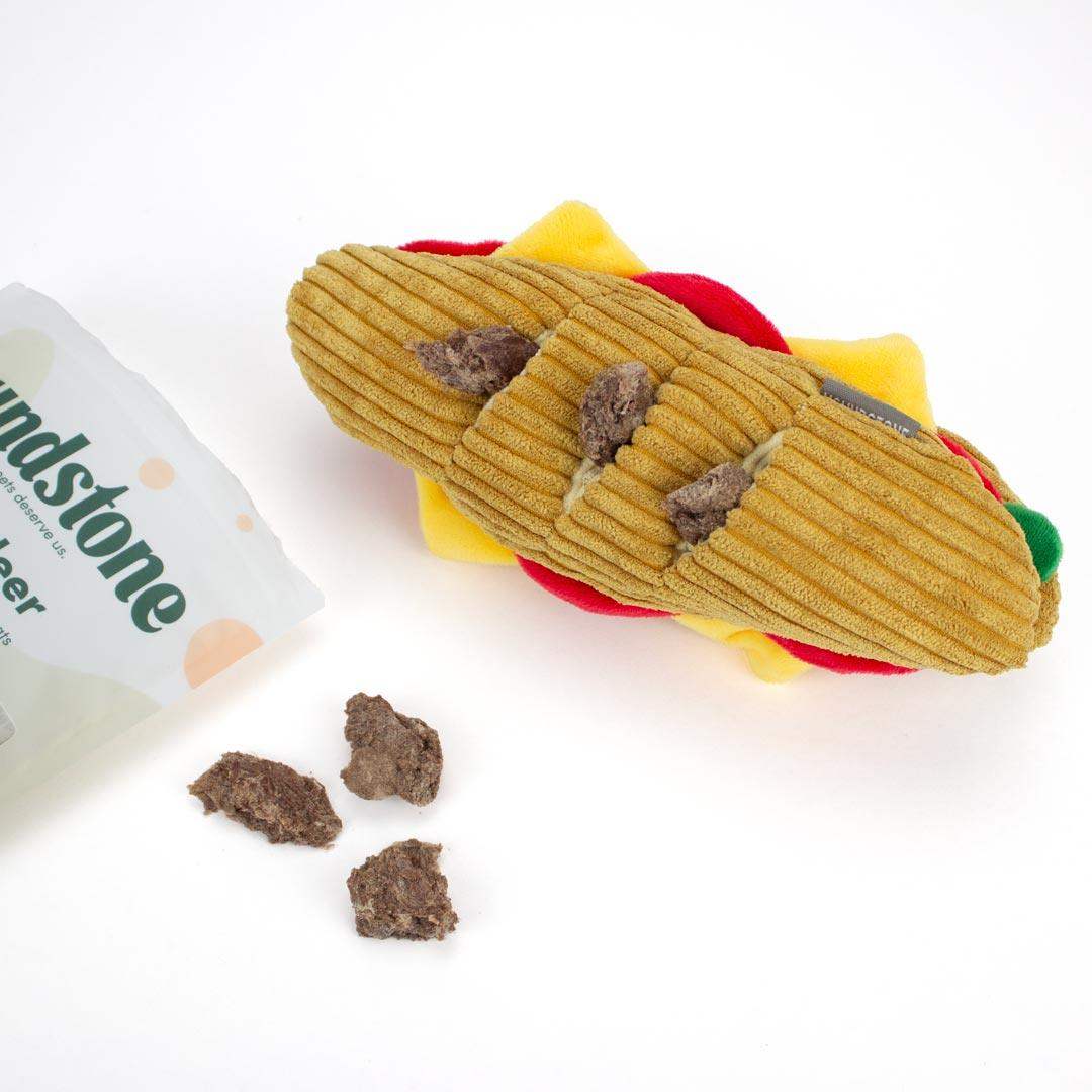 Interactive Dog toys shaped like a sandwich with a package labeled 'Houndstone' on a white background