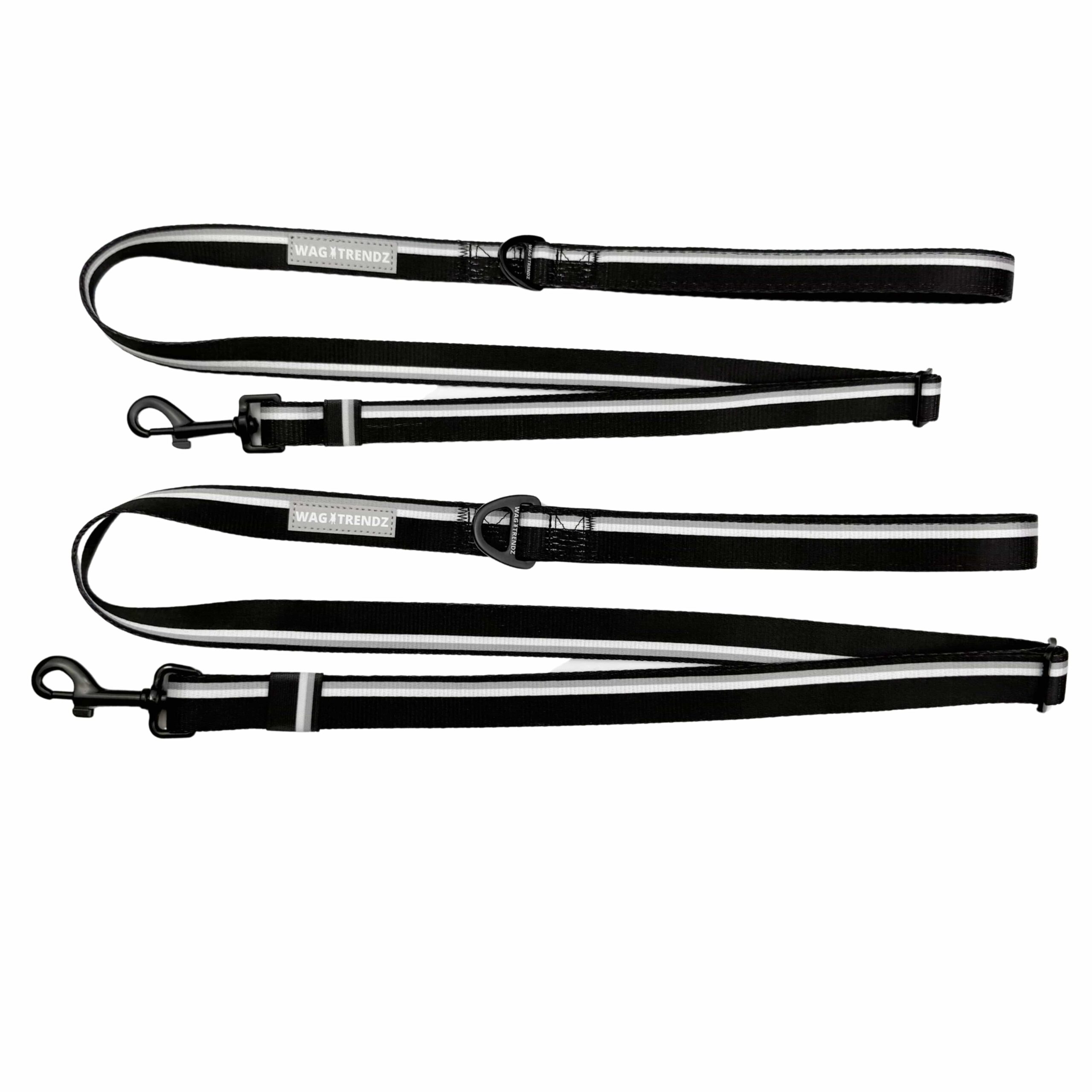 Black adjustable dog leashes with metal clips on a white background