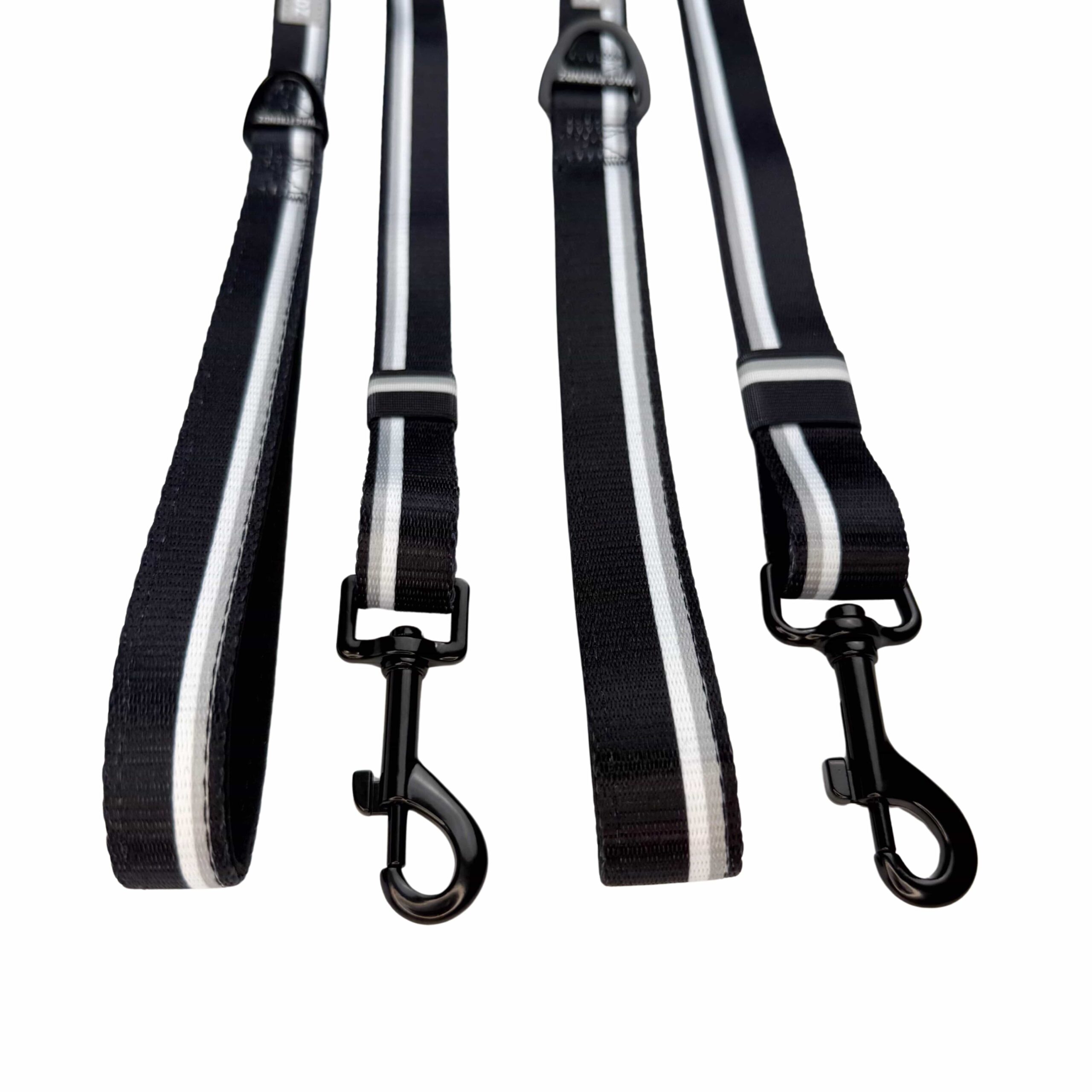 Two black dog leashes with gray and white stripes on a white background