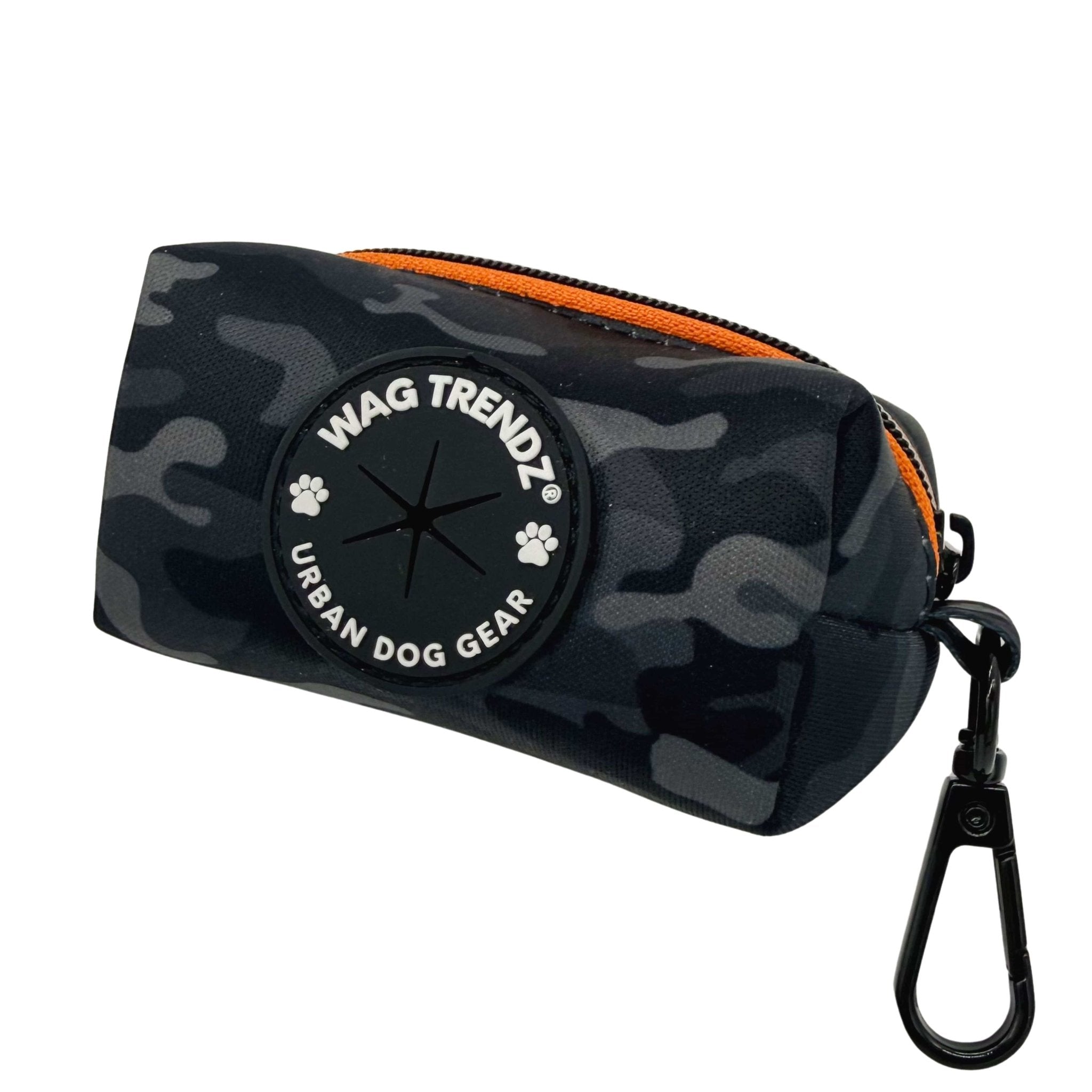Dog Poop Bag Holder in black and gray camo with orange zipper and Wag Trendz logo on a white background